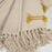 Manta Caitlin 100% algodón beige y mostaza 130 x 170 cm